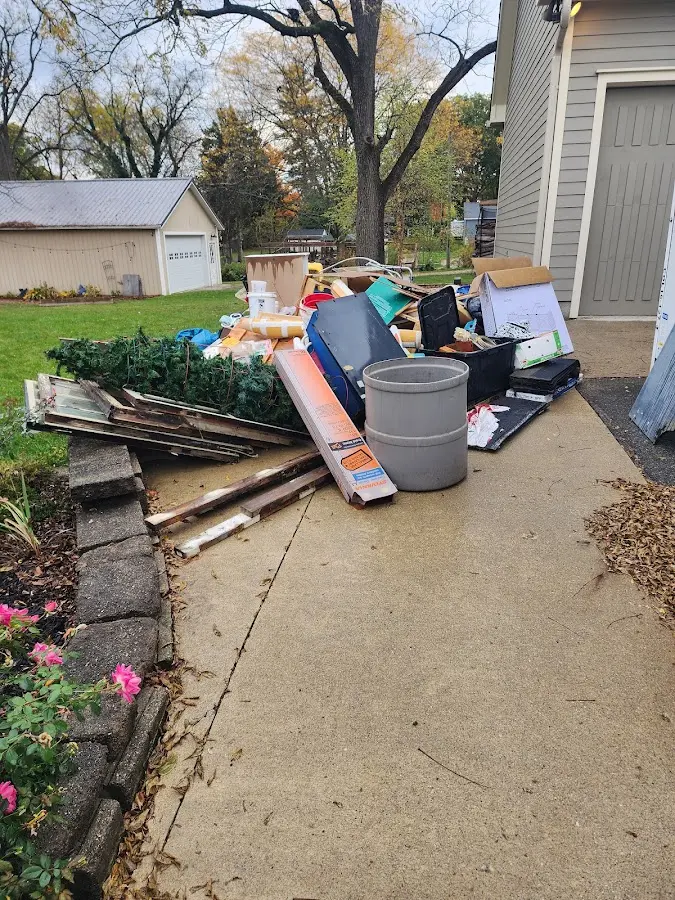 Dumpster being loaded with debris for Commercial Dumpster Rental in Marianna